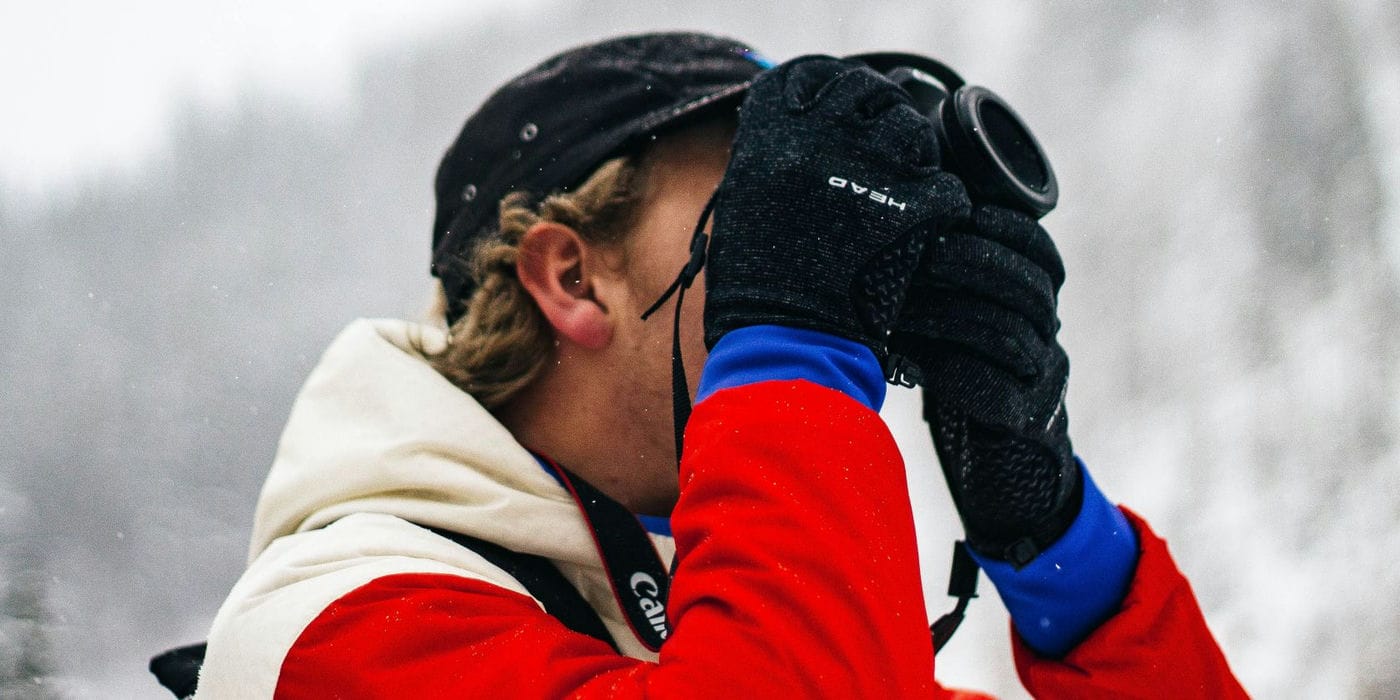 Photo of a person taking pictures outside in the winter 